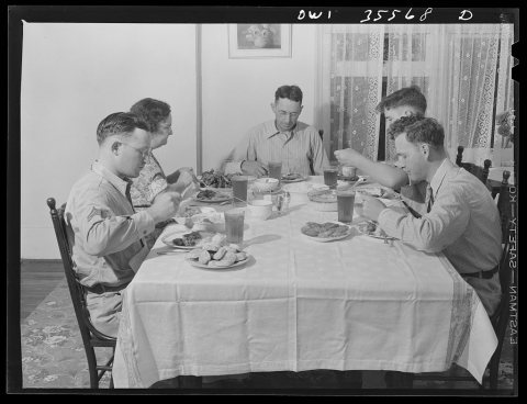 Bowman, South Carolina. Sergeant John Riley, of the 25th service group, Air Service Command, home on leave having dinne…