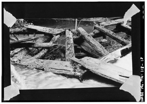 DETAIL AT JUNCTION OF MAIN DAM AT LEFT AND DIVERSION DAM AT RIGHT SHOWING LOG CRIBBING. SPACES INSIDE CRIBBING WERE FIL…