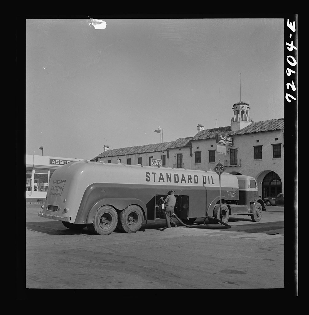 Tracy, California. A gasoline tank truck delivering gasoline to a filling station