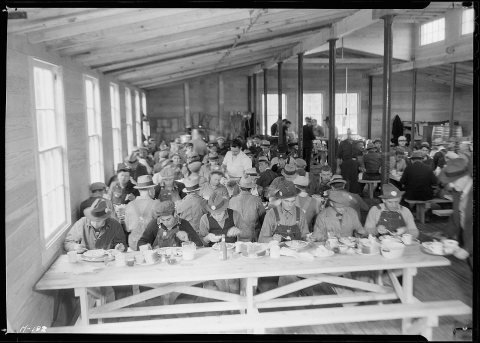 "Noon meal at the cafeteria at Norris townsite."