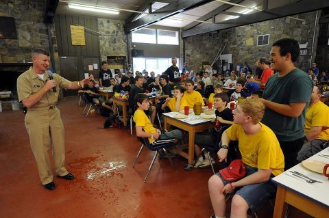 US Navy 090609-N-9818V-258 Master Chief Petty Officer of the Navy (MCPON) Rick West presents a MCPON challenge coin to …