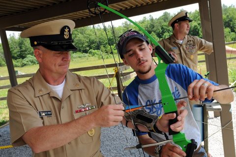 US Navy 090609-N-9818V-142 A staff member from Skymont Boy Scout Camp gives Master Chief Petty Officer of the Navy (MCP…