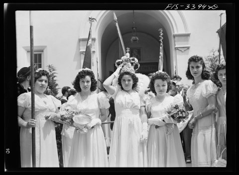 The Queen of the Portuguese-American Festival of the Holy Ghost leaving the church