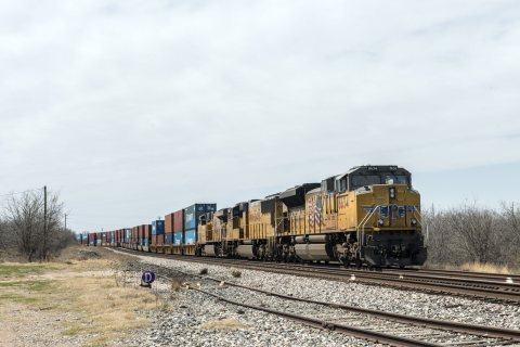 A long Union Pacific freight train approaches near