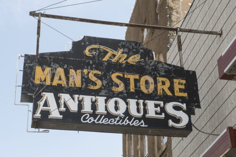 Sign for the old Man's Store antiques and collectibles business in