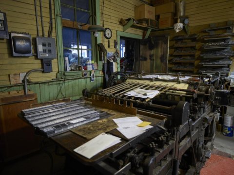 In the tiny, cluttered offices of the weekly Saguache Crescent newspaper, publisher Dean Coombs still sets type the VER…
