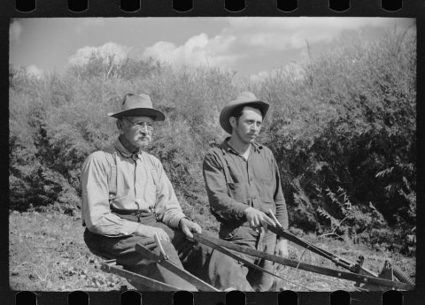 Spanish-American rehabilitation clients working in the field of their farm near San Luis, Colorado