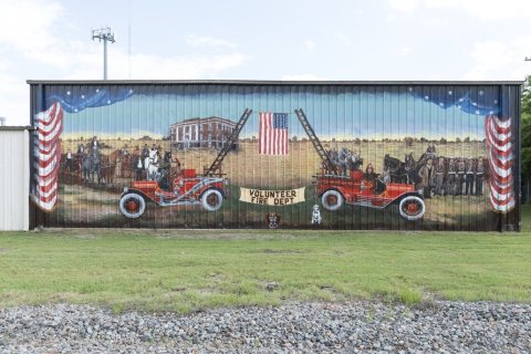 A 2014 mural by artist Sunny DeLipsey of Athens, Texas, depicting the early days of the firefighting service in Terrell…