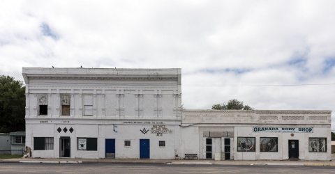 The Masonic Lodge building and adjacent body shop in the town of