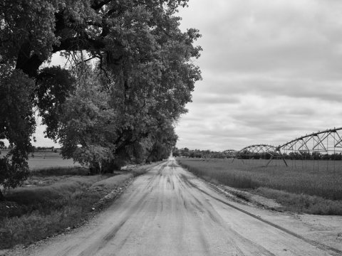 A long irrigation sprinkler, and even longer dirt road, near the town of Granada in Prowers County, Colorado