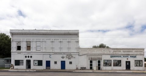 The Masonic Lodge building and adjacent body shop in the town of Granada in Prowers County, Colorado