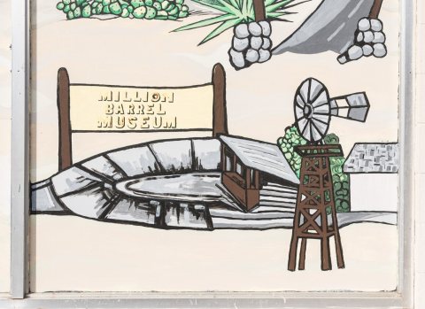 Detail of mural depicting local history, including the era of an oil boom in which the Shell Oil Company created a gian…