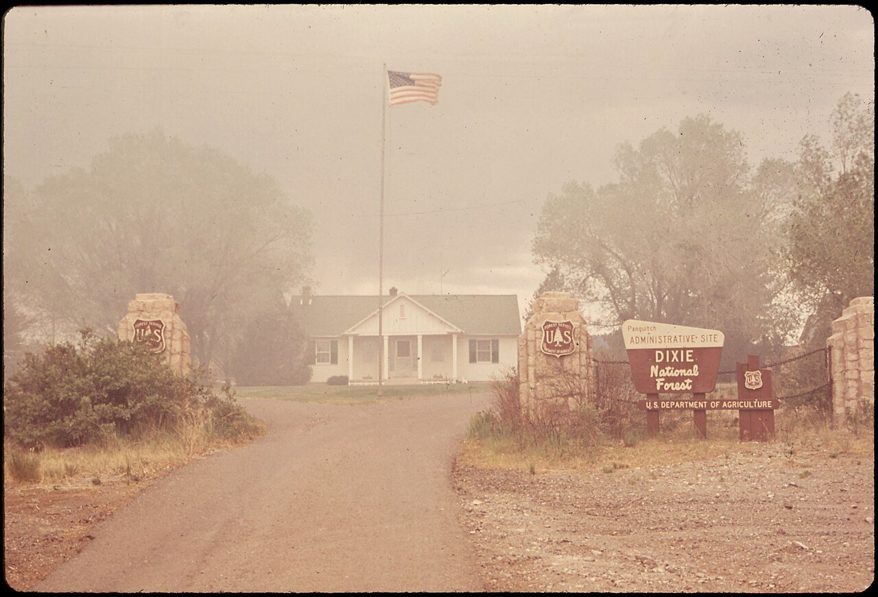 SMOKE FROM LUMBER MILL'S "TEEPEE" BURNER OBSCURES ADMINISTRATION BUILDING