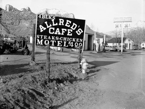 Roadside signs in Springdale. Allred's Cafe. Proposed clean-up of approach to Zion National Park. ; ZION Museum and Arc…