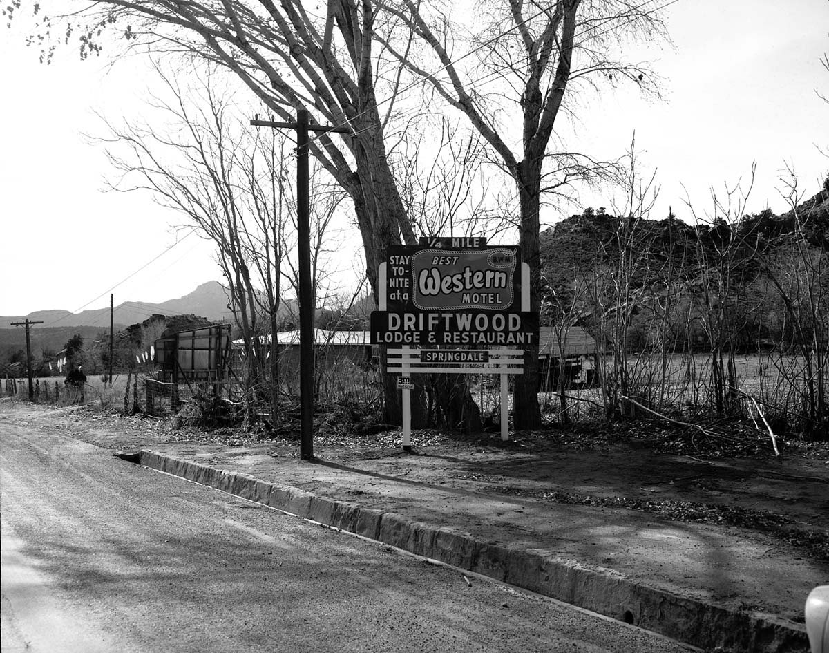 Roadside signs in Springdale. Driftwood Lodge and Restaurant 'Best Western Motel' ; ZION Museum and Archives Image ZION…