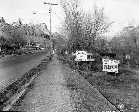 Roadside signs in Springdale, obsolete signs of Hardy Jr. Supermarket and distance to Sinclair service station. ; ZION …