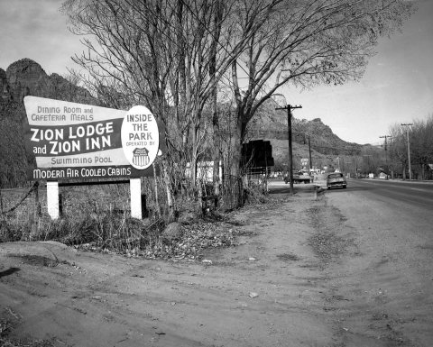 Roadside signs in Springdale, Utah Parks Company - Zion Lodge and Inn. ; ZION Museum and Archives Image ZION 9425 ; ZIO…