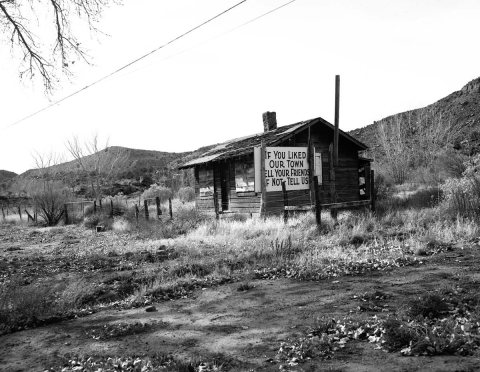 Roadside signs in Springdale, obsolete signs. Image is of an old building with sign on side 'If you like our town tell …