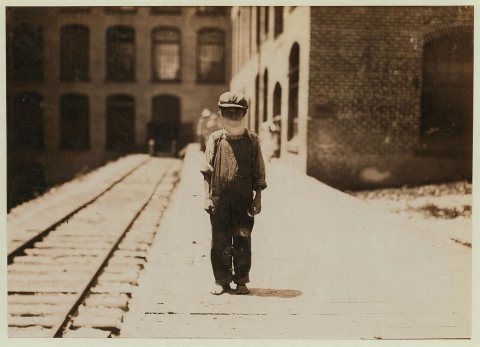 One of the young doffers in Washington Cotton Mills, Fries, Va., going to dinner. Said he was 15 years old, but it is d…