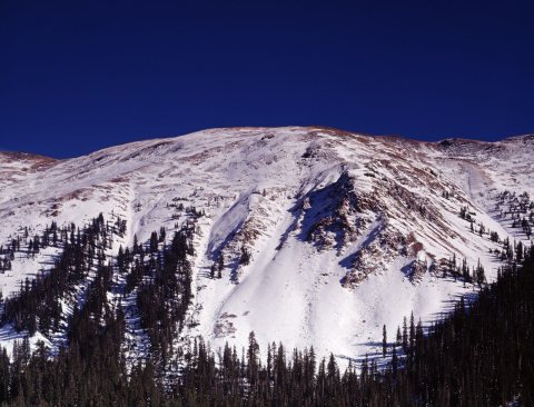Snowy Rocky Mountain peak above