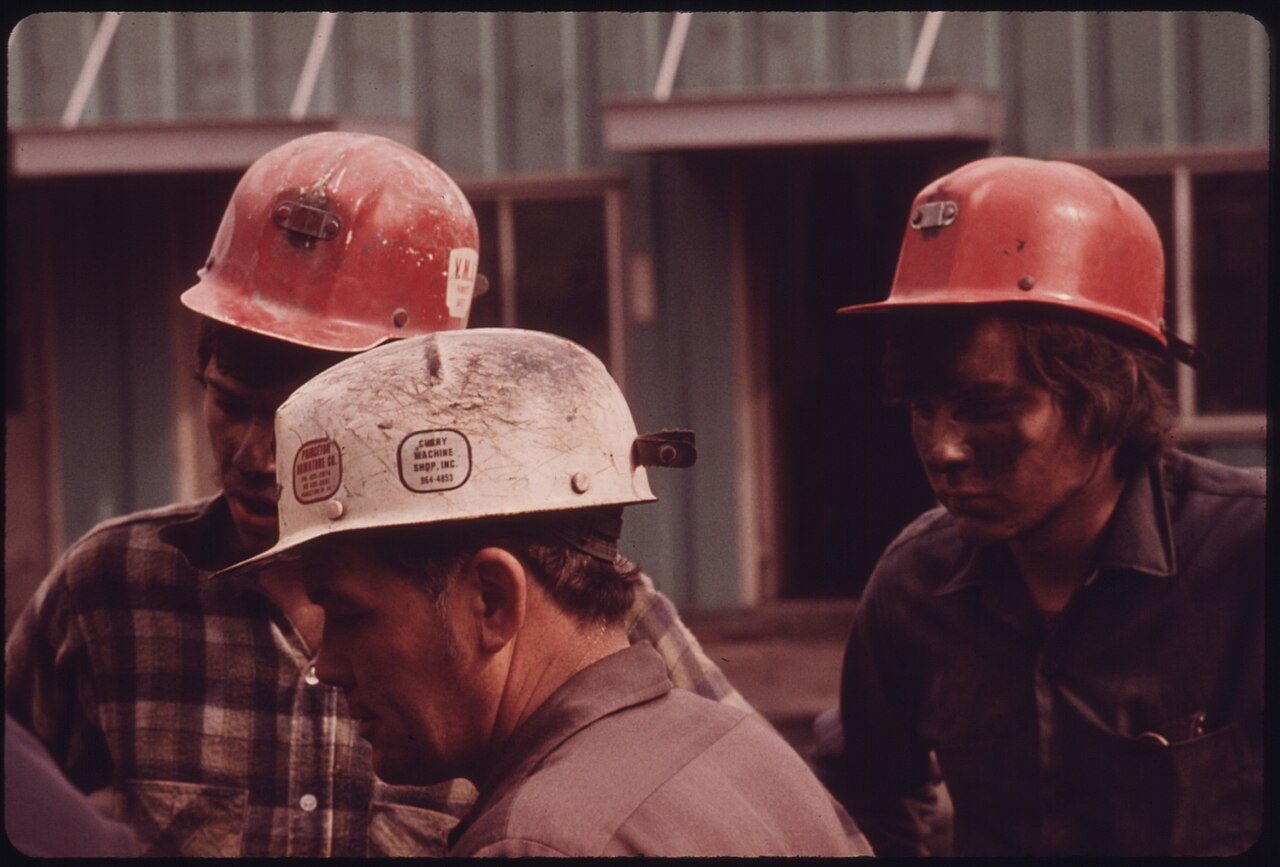 ARNOLD RASNICK, VIRGINIA-POCAHONTAS COAL COMPANY SUPERINTENDENT OF MINE ^4 (IN WHITE HAT), TALKS TO TWO YOUNG MINERS...…