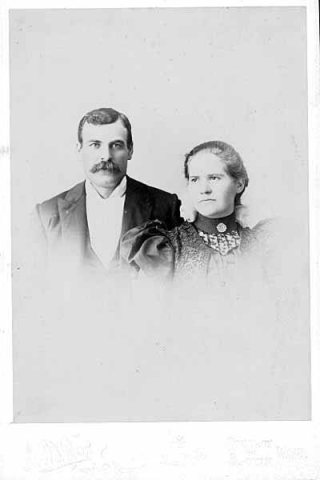 Unidentified man and women in formal attire, Pomeroy, Washington, ca. 1917
