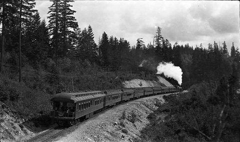 "The Olympian" train (Chicago, Milwaukee & Puget Sound Railroad Number 16), 2 miles east of Maple Valley, Washington, a…
