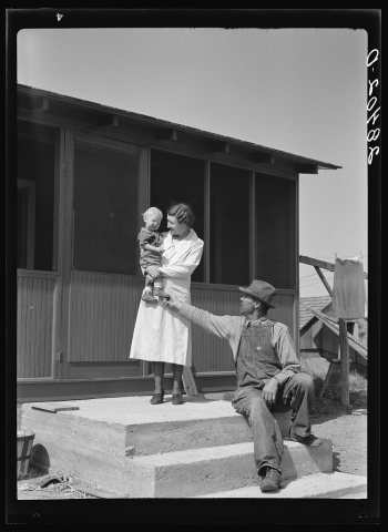 Mr. and Mrs. Calvin Brown and grandson on the steps of their house near Eaton, Colorado. FSA (Farm Security Administrat…