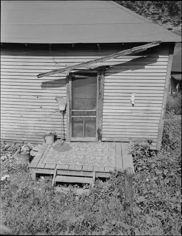 Back door of a house. The screening is supplied by the employee-tenant. The Company is responsible for outside... - NAR…