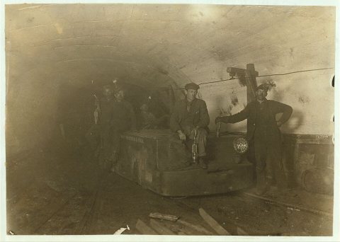 Bank boss, (with lamp between knees) Motorman, Brake-boy and Driver. Gary Mine