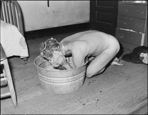 Milong Bond taking a bath. Because of having to carry water from slow running outside faucet he tries to get the most..…