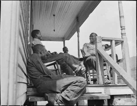 Negro boy, son of miner, drinking from faucet. This is the only constant source of water in the camp. Mullens... - NARA…