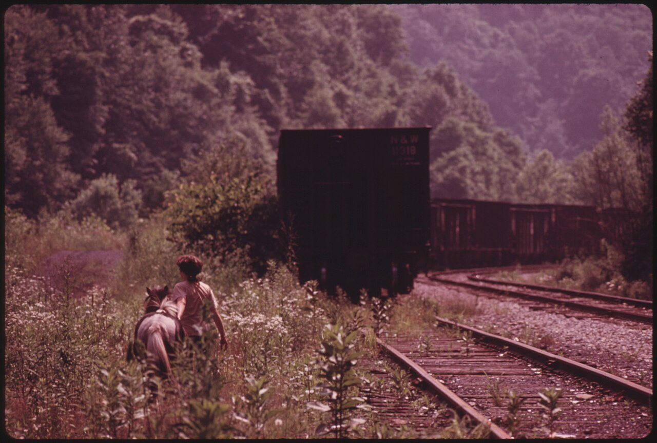 DONNA SMITH, RHODELL, WEST VIRGINIA, NEAR BECKLEY, LEADS HER PONY TO ITS QUARTERS IN A BARN BY THE RAILROAD TRACKS.... …