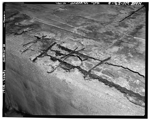 DETAIL VIEW SHOWING EXPOSED REINFORCING BARS. - Bridgeport Lamp Chimney Company, Simpson Creek Bridge, Spanning Simpson…