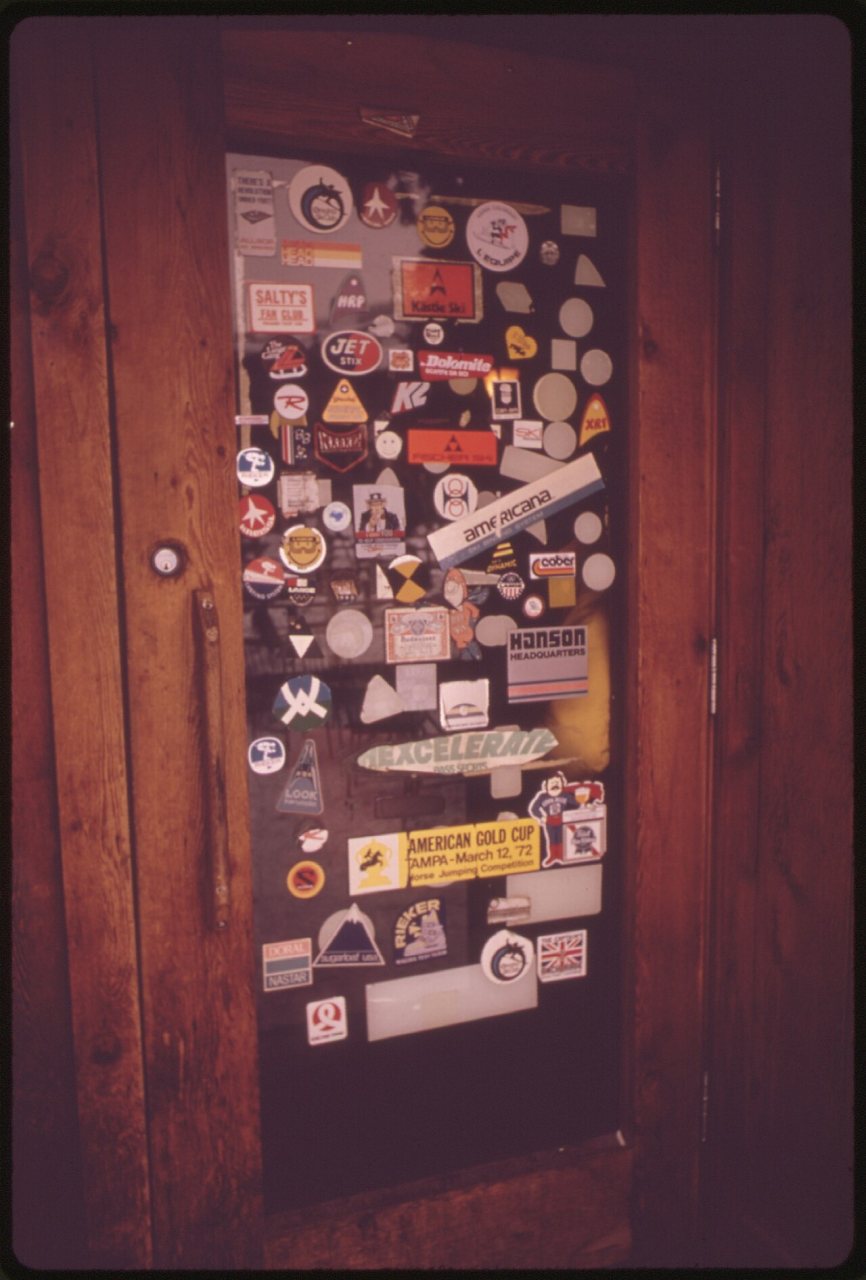 SKI EMBLEMS DECORATE DOOR OF DONOVANS, AN APRES SKI SPOT