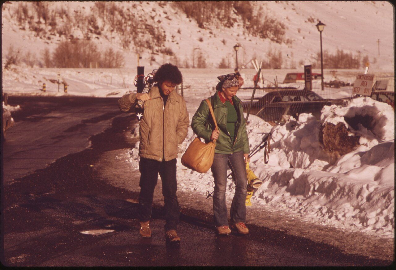 RETURNING TO THE VILLAGE AFTER A DAY OF SKIING