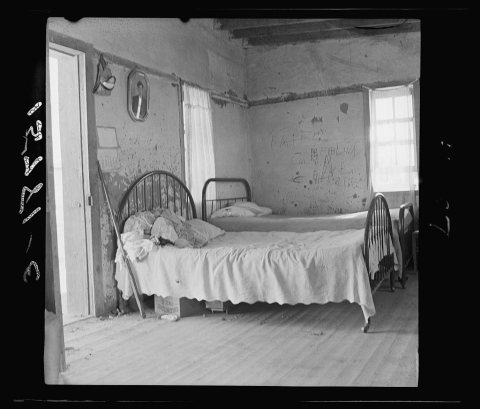 In this single-room house on these two beds sleep the mother, three sisters and the brothers (six altogether). Great We…