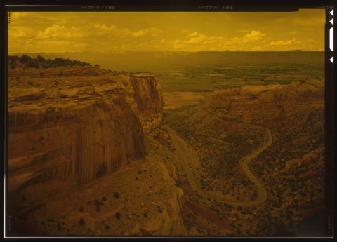 VIEW OF SWITCHBACKS FROM RIM ROAD. RIM ROAD CAN BE SEEN AT UPPER LEFT ATOP CLIFF FACE - Rim Rock Drive