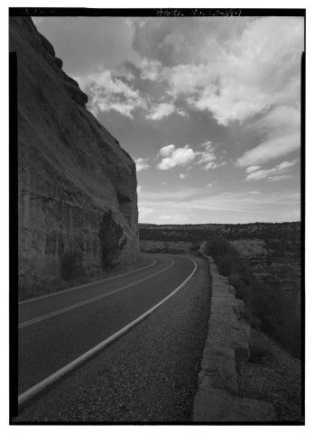 ROAD VIEW WITH ROCK CUT AND GUARD WALL. - Rim Rock Drive