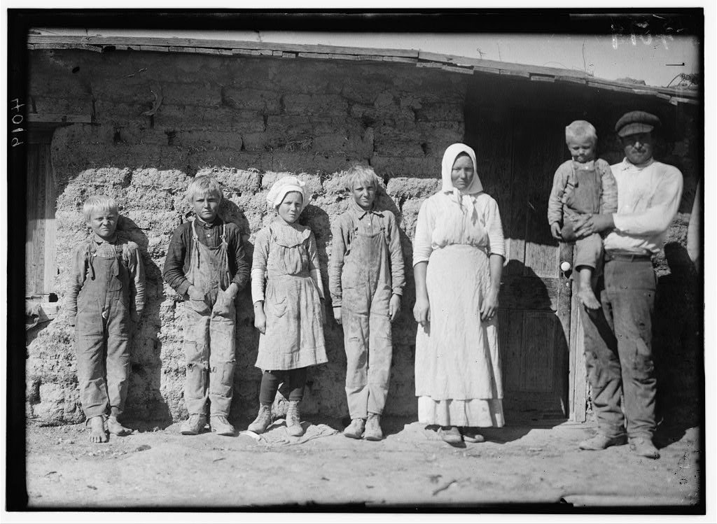 Family of Fred Karb and their mud shack - beet workers near Sterling, Colo. They all work from 5-30 A.M. to 7-00 P.M. w…