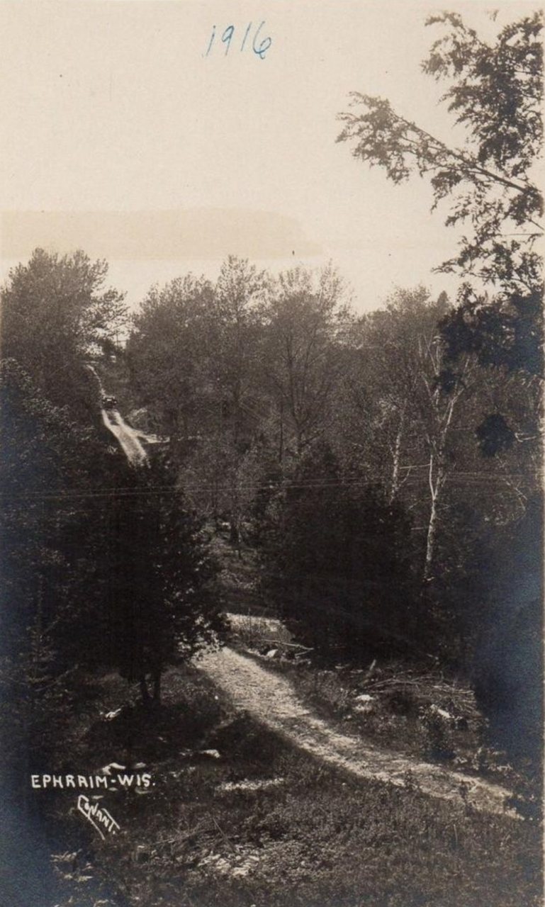 Car near the top of a dirt road