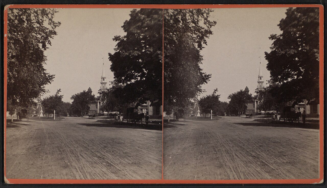 View of a street in Southington (with a church in background)