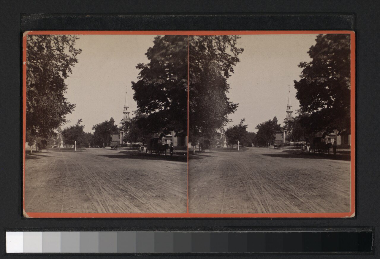 View of a street in Southington (with a church in background)