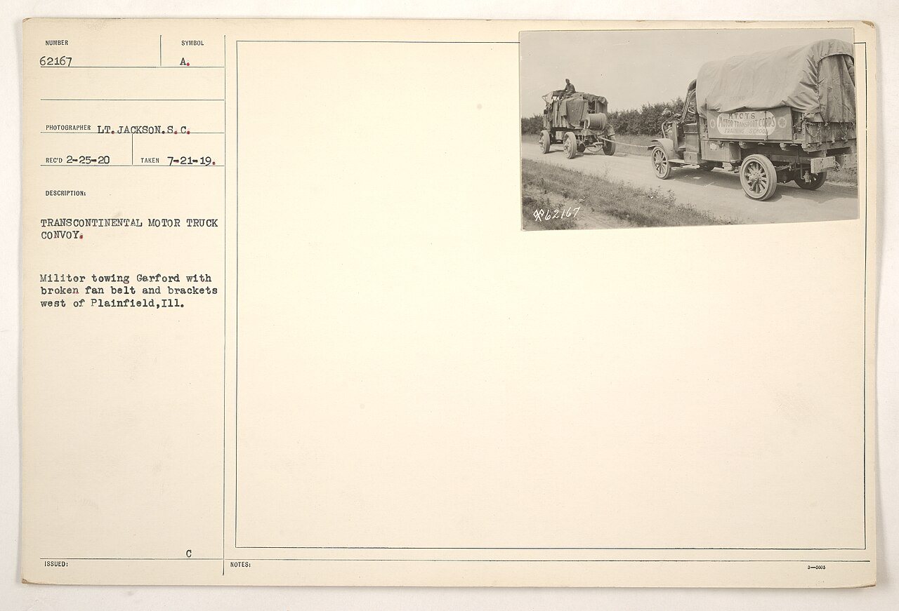Transcontinental motor truck convoy. Militor towing Garford with broken fan belt and brackets west of Plainfield, Ill