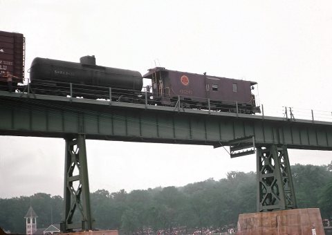 CGW 115-A (F5A) Caboose westbound freight -143 crossing over the Fox River at St. Charles, IL on July 4, 1962