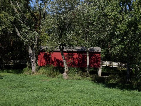 The Sugar Creek Covered Bridge, near Chatham, Illinois. The 1880 bridge, built by Thomas Black, spans 60 feet over the …