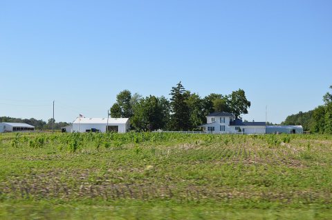 Small field with farmhouse in Monroe Township