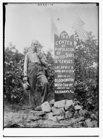 The Center of Population of U.S. (man standing next to memorial stone)