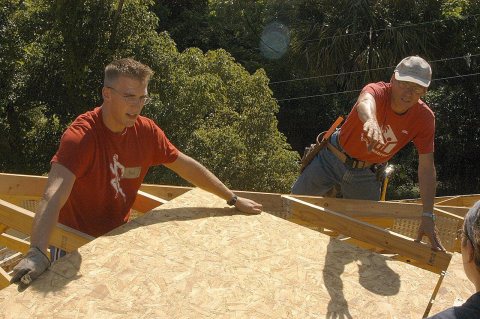 US Navy 060519-N-6645H-060 Hospital Corpsman 3rd Class Jonathan Grooms, left, and Beaches Habitat Construction Manager …