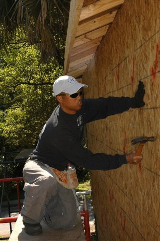 US Navy 060519-N-6645H-086 Chief Religious Program Specialist Fermin Ancho helps construct a house for Beaches Habitat